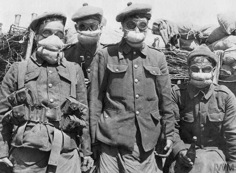 Men of the 2nd Argyll and Sutherland Highlanders wearing cotton-waste pad-respirators, 1915. © The rightsholder (IWM Q 48951)