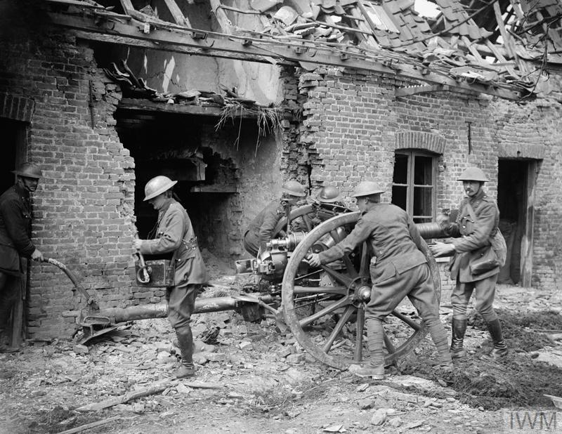he Battle of the Lys. Gunners of the Royal Field Artillery manhandling a 18 pounder gun into a firing position beside a ruined house in the village of Saint-Floris, 2 May 1918.