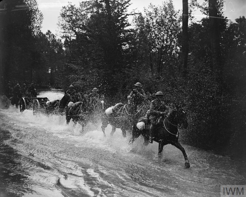 Royal Horse Artillery (13 pounder) battery galloping through a river, 1918. © IWM (Q 6722)